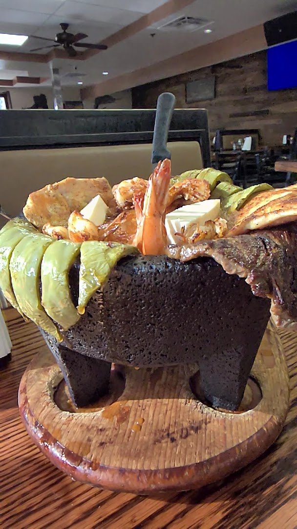 Colorful Mexican dishes on shared plates.